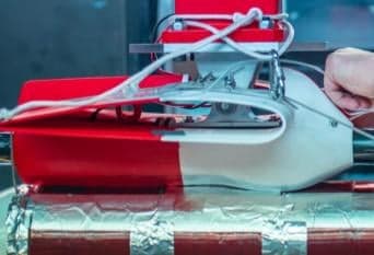 The fairing mounted in the wind tunnel with the vertical cutout added to clear the mounting hardware