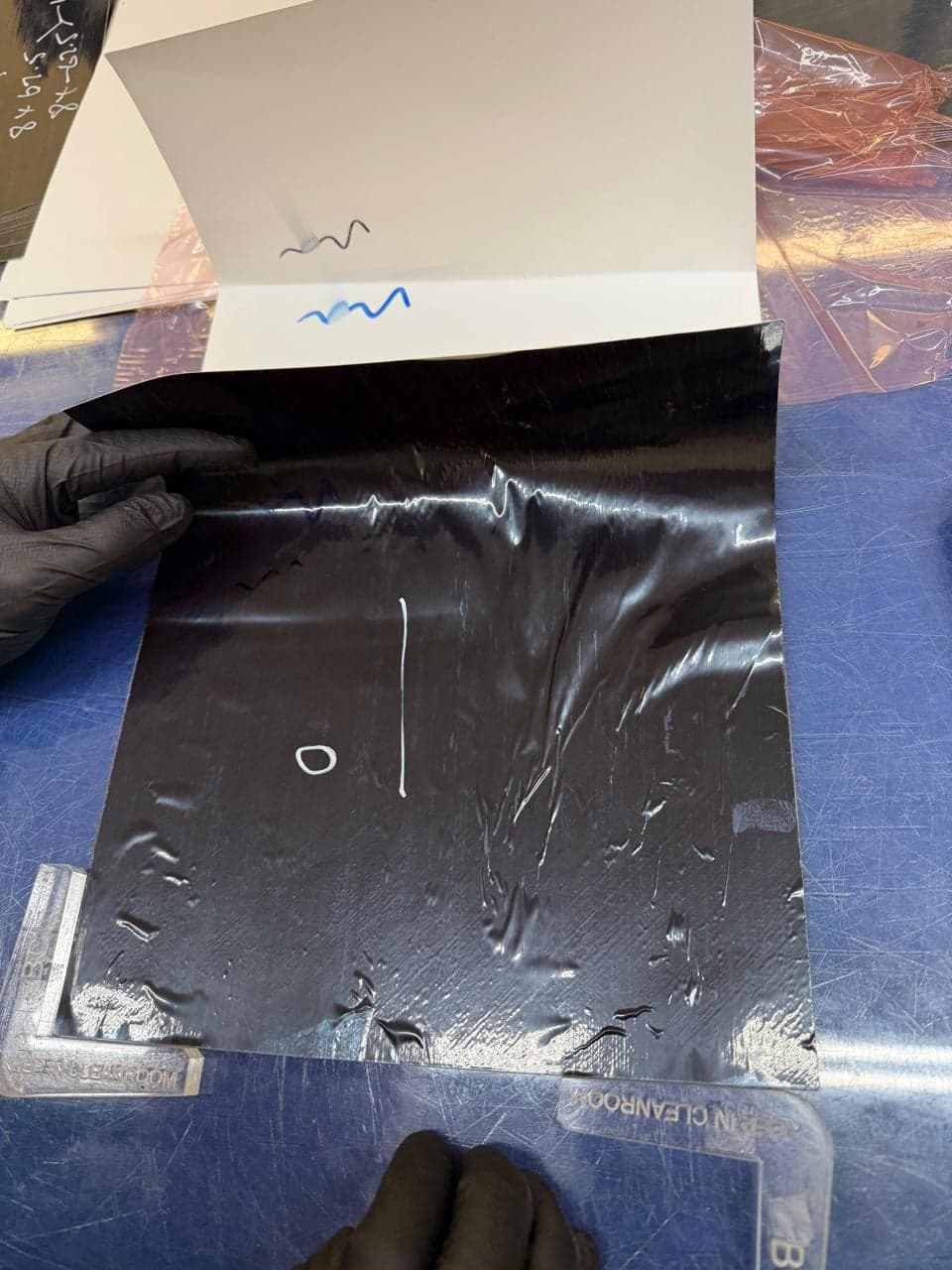 Close view of wrinkling concentrated on the positive-angle plies of the laminate